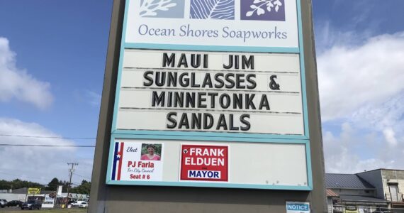 Photo courtesy of Frank Elduen
Campaign signs for PJ Faria (city council candidate) and Frank Elduen (mayor candidate) and are mounted to the marquee board outside Ocean Shores Soapworks at 710 Point Brown Ave. A dispute over the placement of the signs led the Ocean Shores code enforcement officer to file a formal complaint against Elduen.