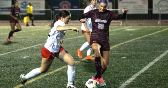 RYAN SPARKS | THE DAILY WORLD Montesano senior Mikayla Stanfield (10) possesses the ball against Tenino sophomore Kyra Dirks during the Bulldogs’ 4-0 victory on Tuesday in Montesano.