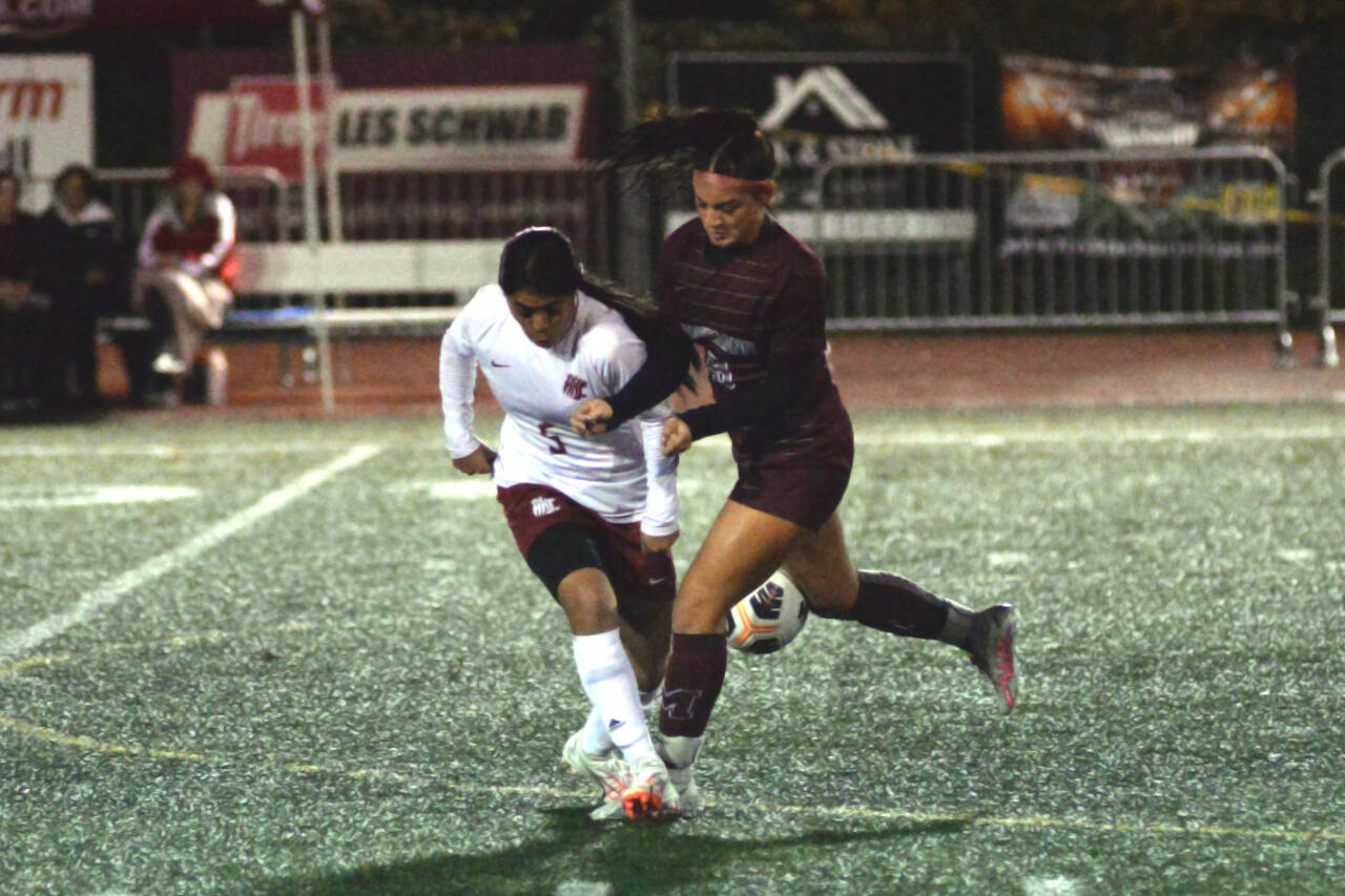 RYAN SPARKS | THE DAILY WORLD Montesano’s Addison Potts, right, collides with Hoquiam defender Briana Herrera during the Bulldogs’ 14-0 win on Tuesday at Montesano High School.