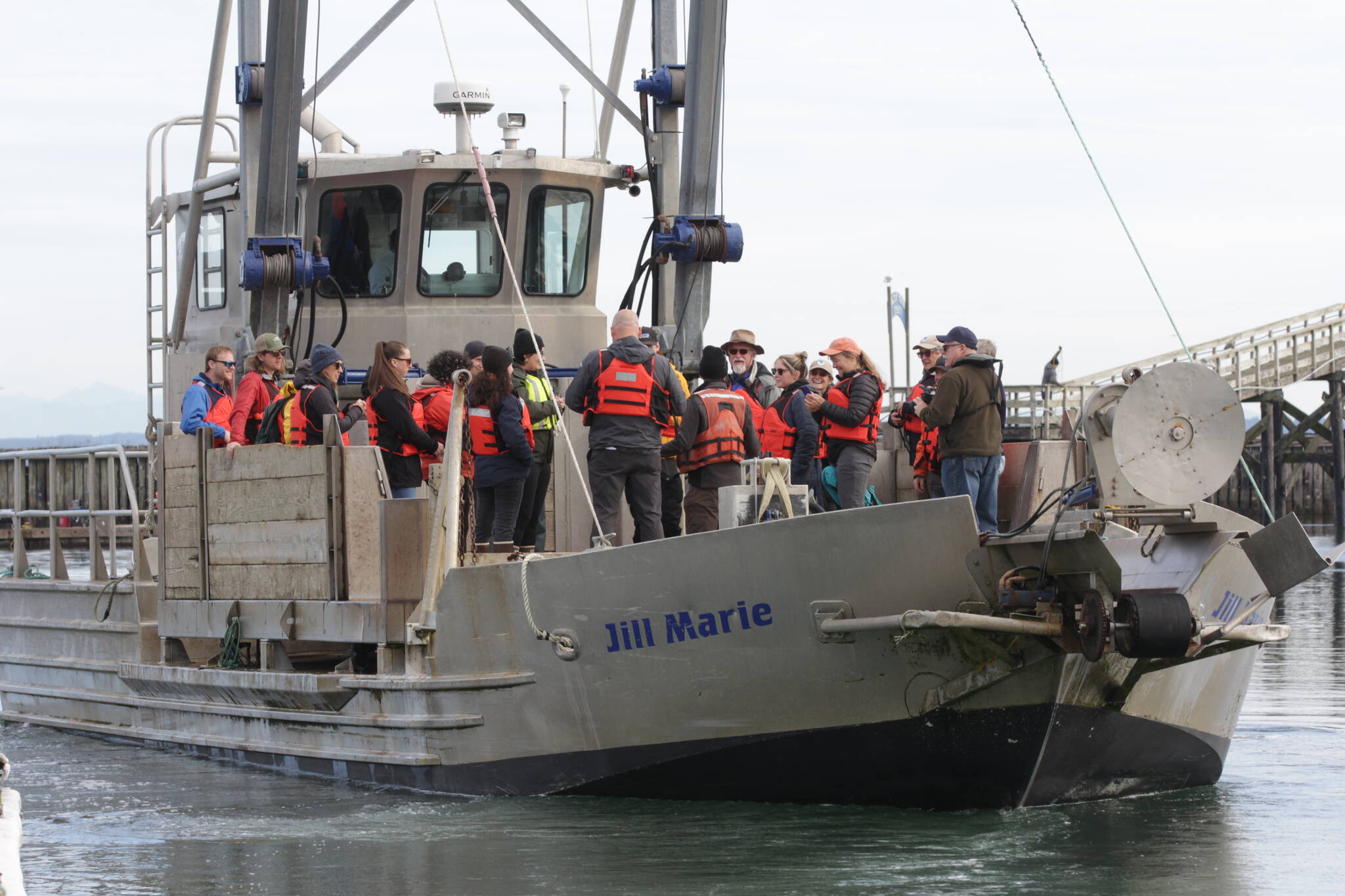 Members of the Marine Resource Committee go out to see crews collecting European green crab near Westport on Oct. 13, 2023. (Michael S. Lockett / The Daily World)