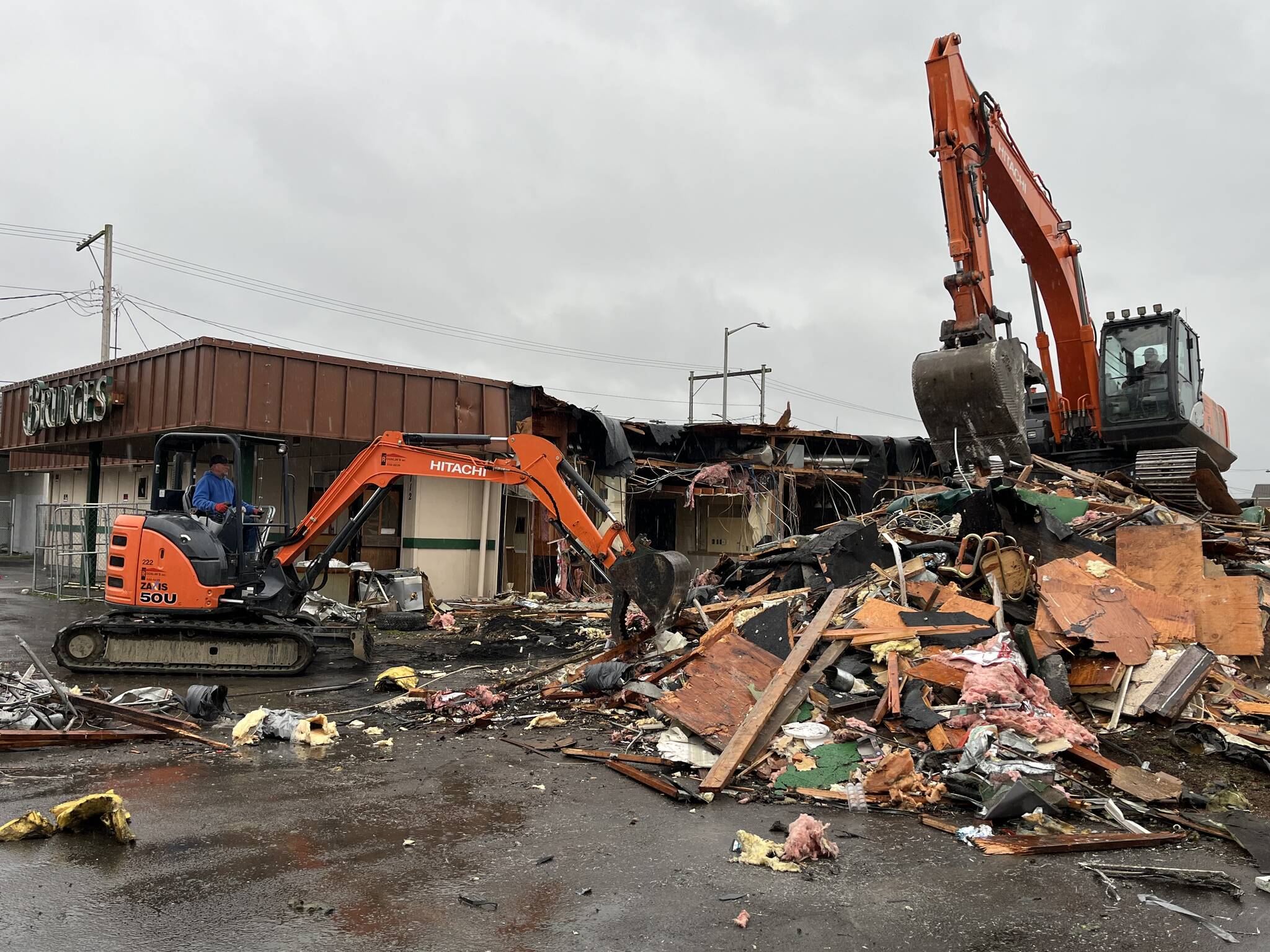 Matthew N. Wells / The Daily World
On Tuesday morning, Rognlin’s, Inc. tore down the former Bridges Restaurant, 112 N. G St., in Aberdeen. The restaurant closed in Oct. 2012, according to Lauren Nichol, former night shift supervisor at Bridges. The building’s owner ordered the teardown, according to Lisa Scott, community development director for the city of Aberdeen. Nichol, who worked there from 1998 until the day the restaurant closed, provided a comment after finding out Bridges was demolished. “I’m glad, it made me sad to look at it that way,” Nichol said. “It was a great place to work.”