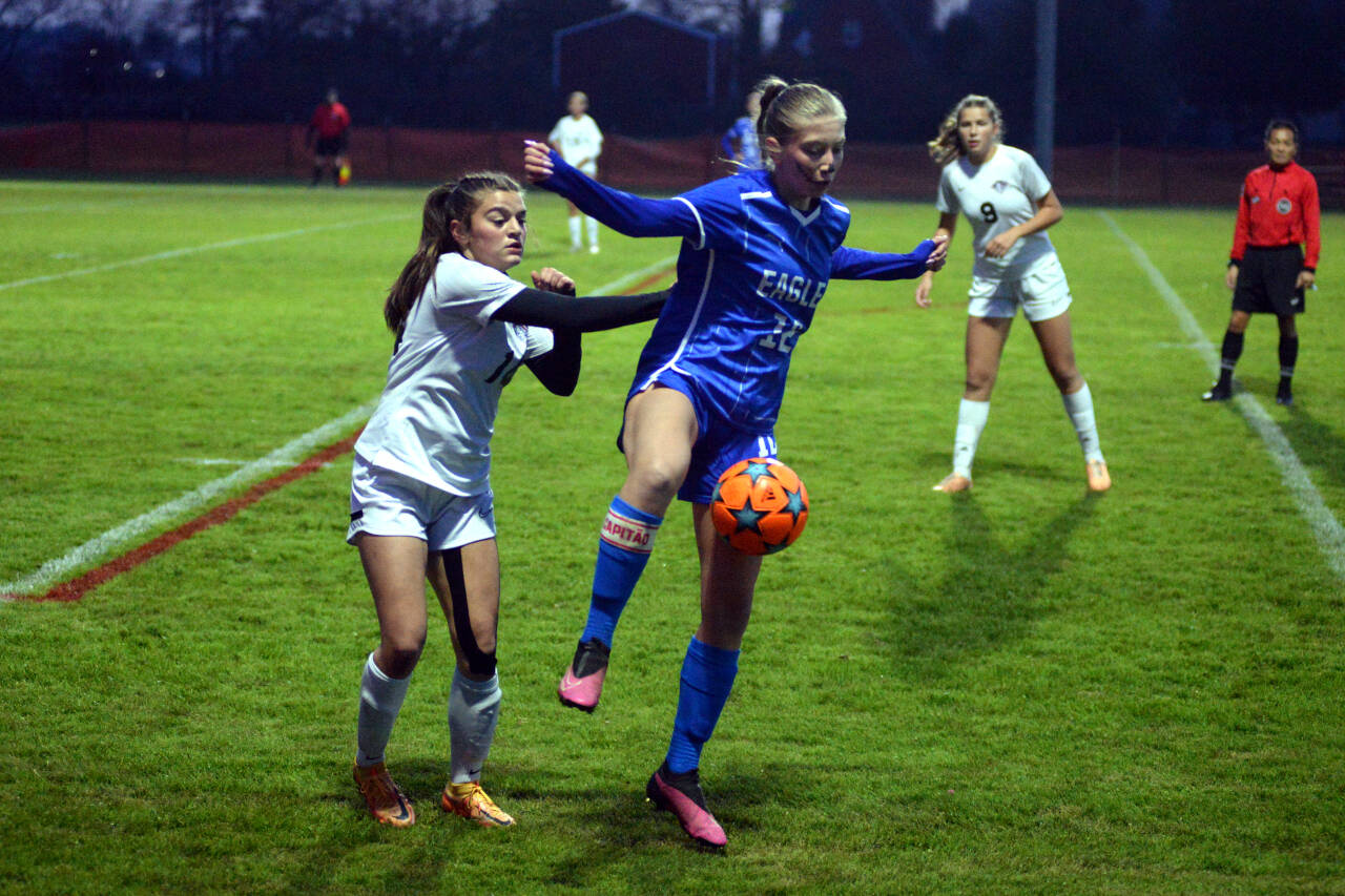 RYAN SPARKS | THE DAILY WORLD Elma junior Beta Valentine (12) holds possession of the ball against King’s Way Christian’s Kaitlyn Delamarter during the Eagles’ 3-0 win in a 1A Division 4 Tournament first-round game on Tuesday at Elma High School.