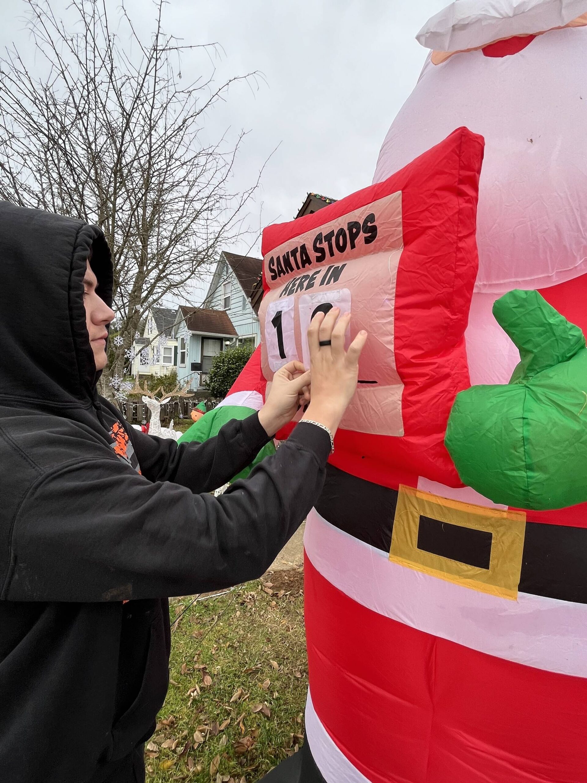 Matthew N. Wells / The Daily World
Bryson Walker updates his calendar that shows the number of days until Santa Claus and his eight reindeer show up in Hoquiam. Walker works for weeks on his family’s elaborate display. He started helping out at 12, but since he turned 15, it’s mainly been his yearly project.