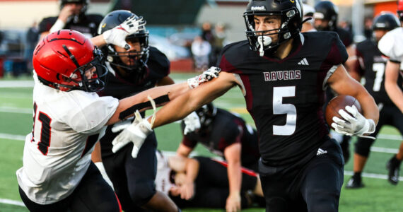 PHOTO BY LARRY BALE Raymond-South Bend senior Ferrill Johnson (5), seen here in a file photo, was named to the WSFCA 2B All-State Team as a kick returner.