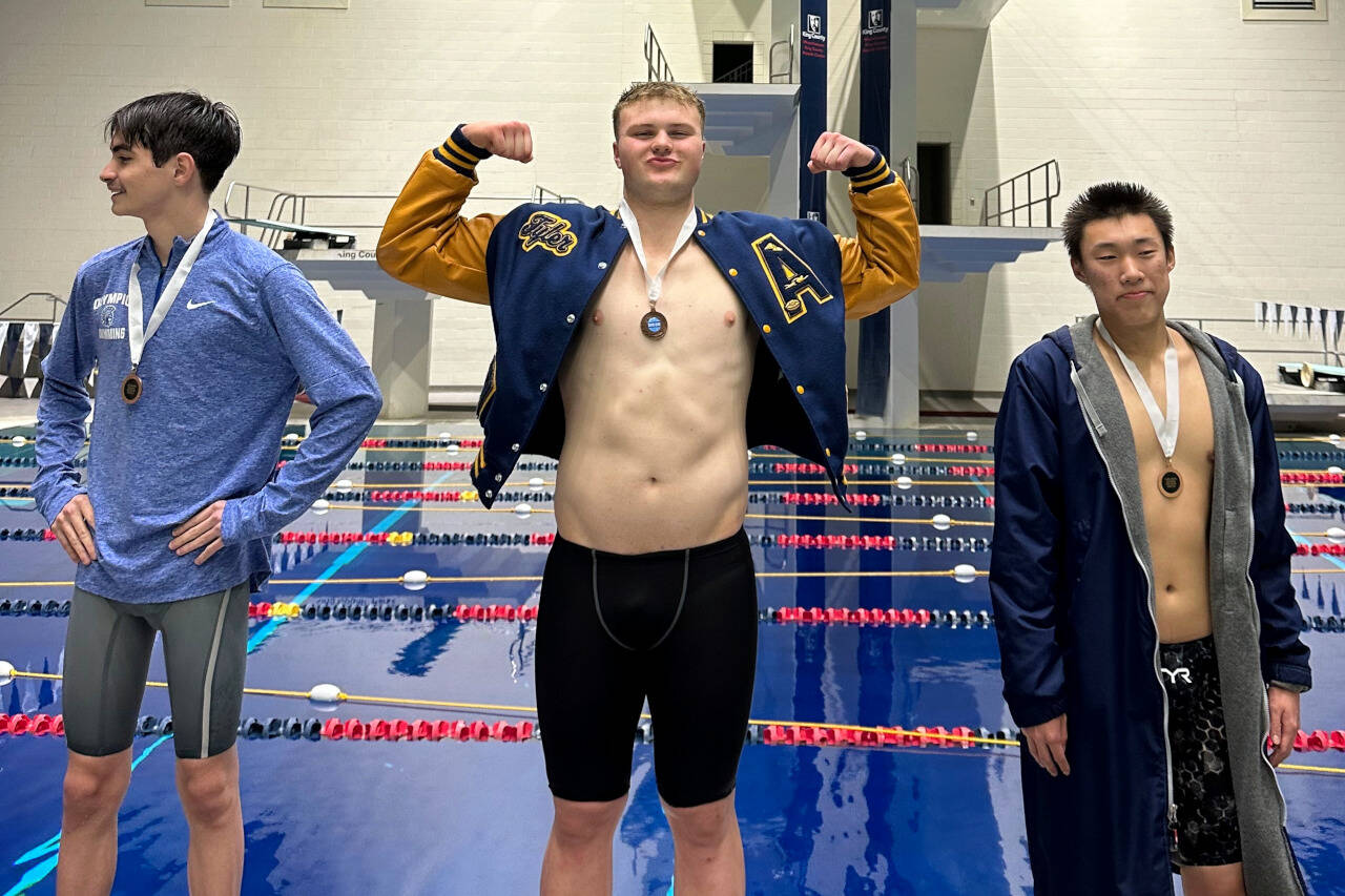 SUBMITTED PHOTO Aberdeen’s Tyler Bates, middle, placed in the top eight in two events at the 2A State Tournament on Saturday at the King County Aquatic Center in Federal Way.