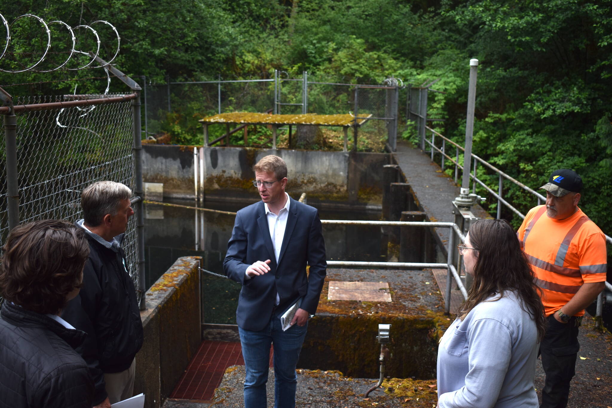 U.S. Rep. Derek Kilmer talks with Hoquiam City Administrator Brian Shay during a July 24, 2024 visit to the West Fork Hoquiam Dam. A recent congressional spending bill includes $500,000 for the city’s dam removal and water supply project. (The Daily World file photo)