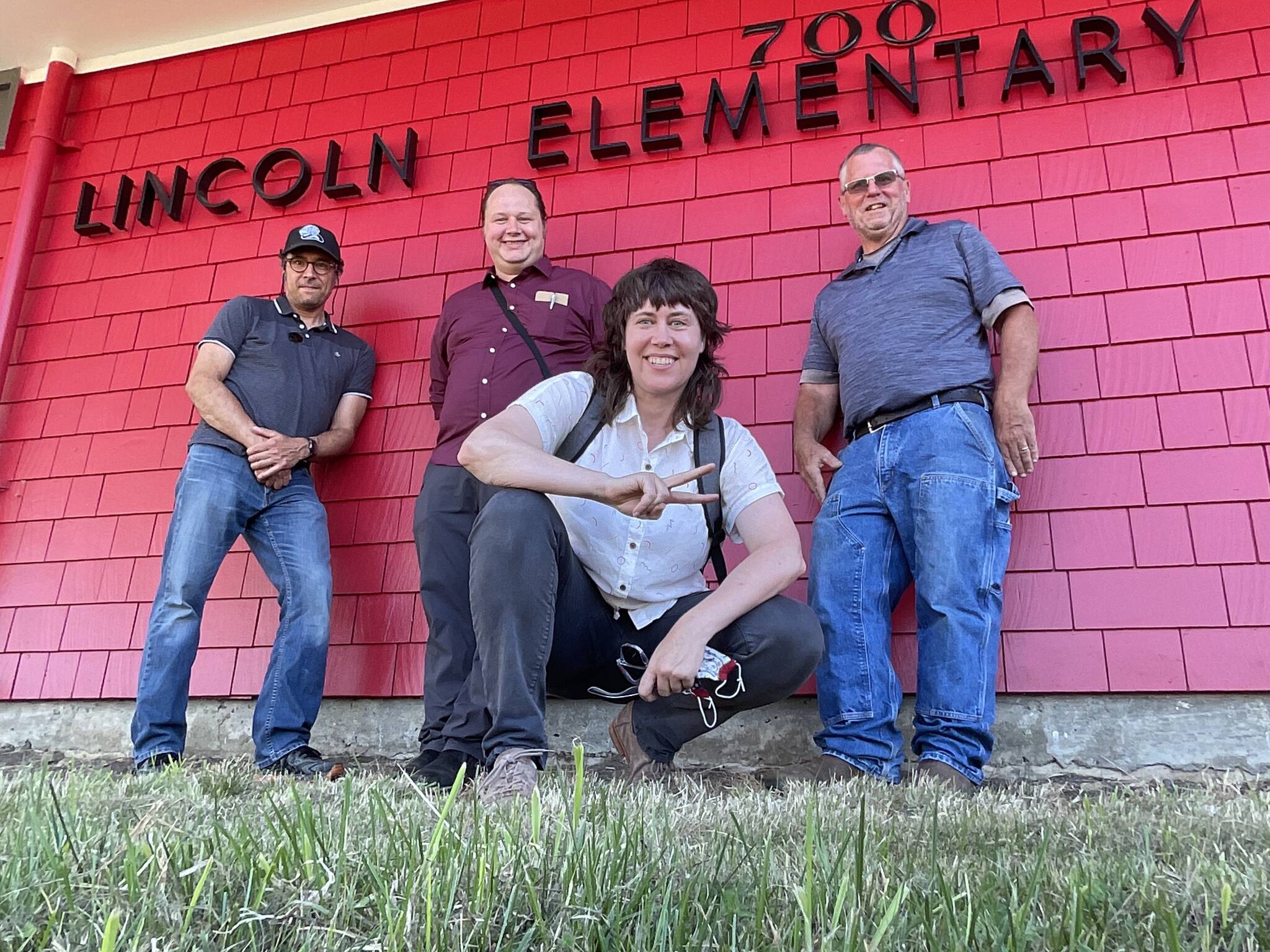 Community Energy Labs
Tanya Barham, center, CEO of Community Energy Labs, poses with Hoquiam School District maintenance lead Matt Kemph and others outside Lincoln Elementary School in Hoquiam. The company recently tested an energy saving tool at the elementary school and completed a study of how to transition Grays Harbor schools to a more energy-efficient model.