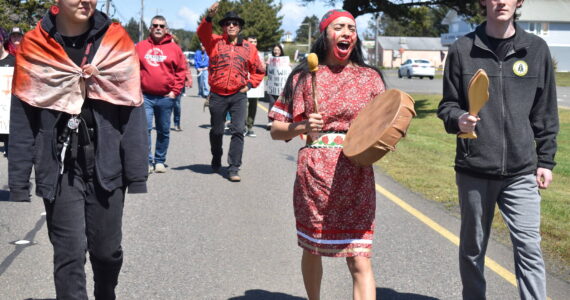 Clayton Franke / The Daily World
Alex Taylor, right, a sophomore in the North Shore School District, Lauren Nabahe, center, a native education program manager in King County, and Rain Gamble, a senior in the Seattle Public Schools district, walk down Point Brown Avenue in Ocean Shores on May 7 during an event to raise awareness for Missing and Murdered Indigenous People.