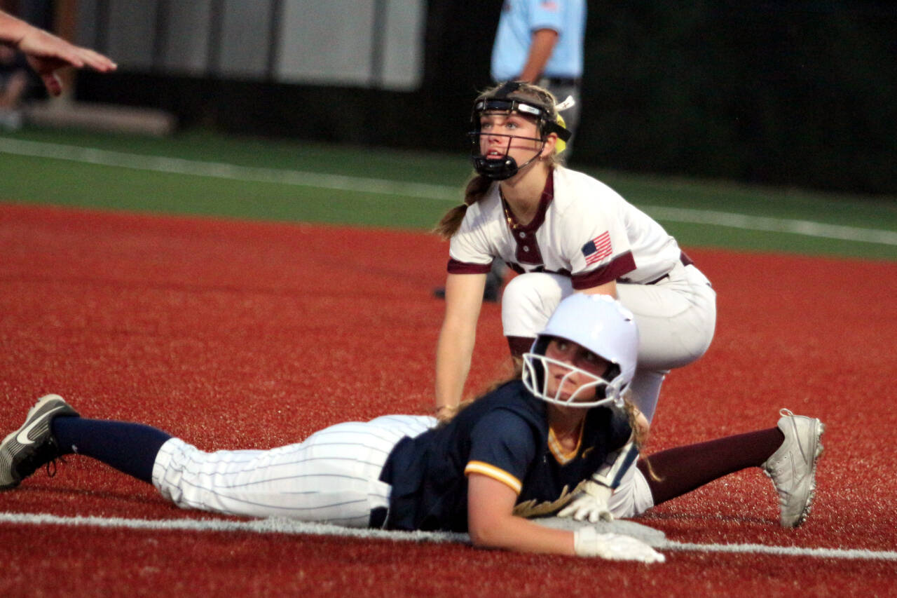 RYAN SPARKS | THE DAILY WORLD Aberdeen outfielder Scotlyn Lecomte (bottom) is safe at third ahead of the tag by Montesano’s Lex Stanfield during the Bulldogs’ 3-2 victory on Friday in Montesano.