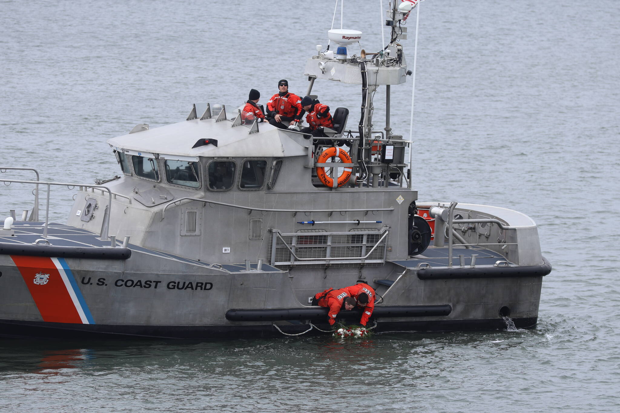 Michael S. Lockett / The Daily World
Coast Guardsmen from Station Grays Harbor lay a memorial wreath during the Blessing of the Fleet ceremony on Sunday in Westport.