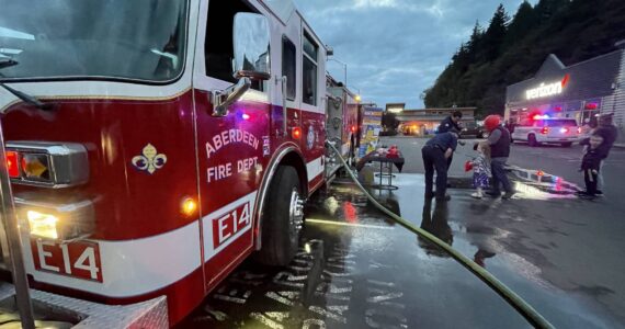 Michael S. Lockett / The Daily World
The Aberdeen Fire Department demonstrated spraying down a target at Badges and Brews, hosted at Starbucks on Sept. 22, 2022.