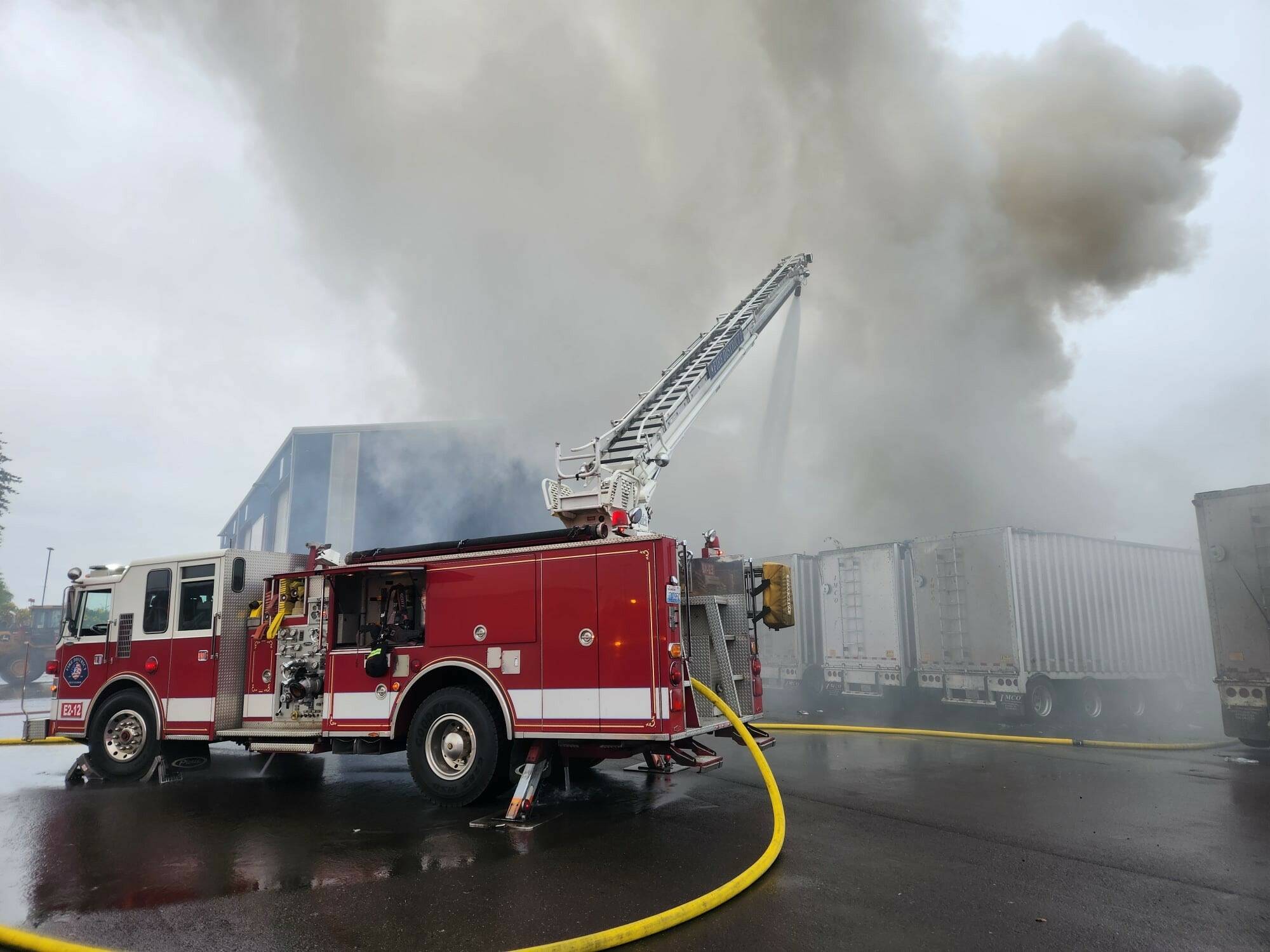 Firefighters work to extinguish a trash fire early Sunday morning. (Courtesy photo / GHFD2)