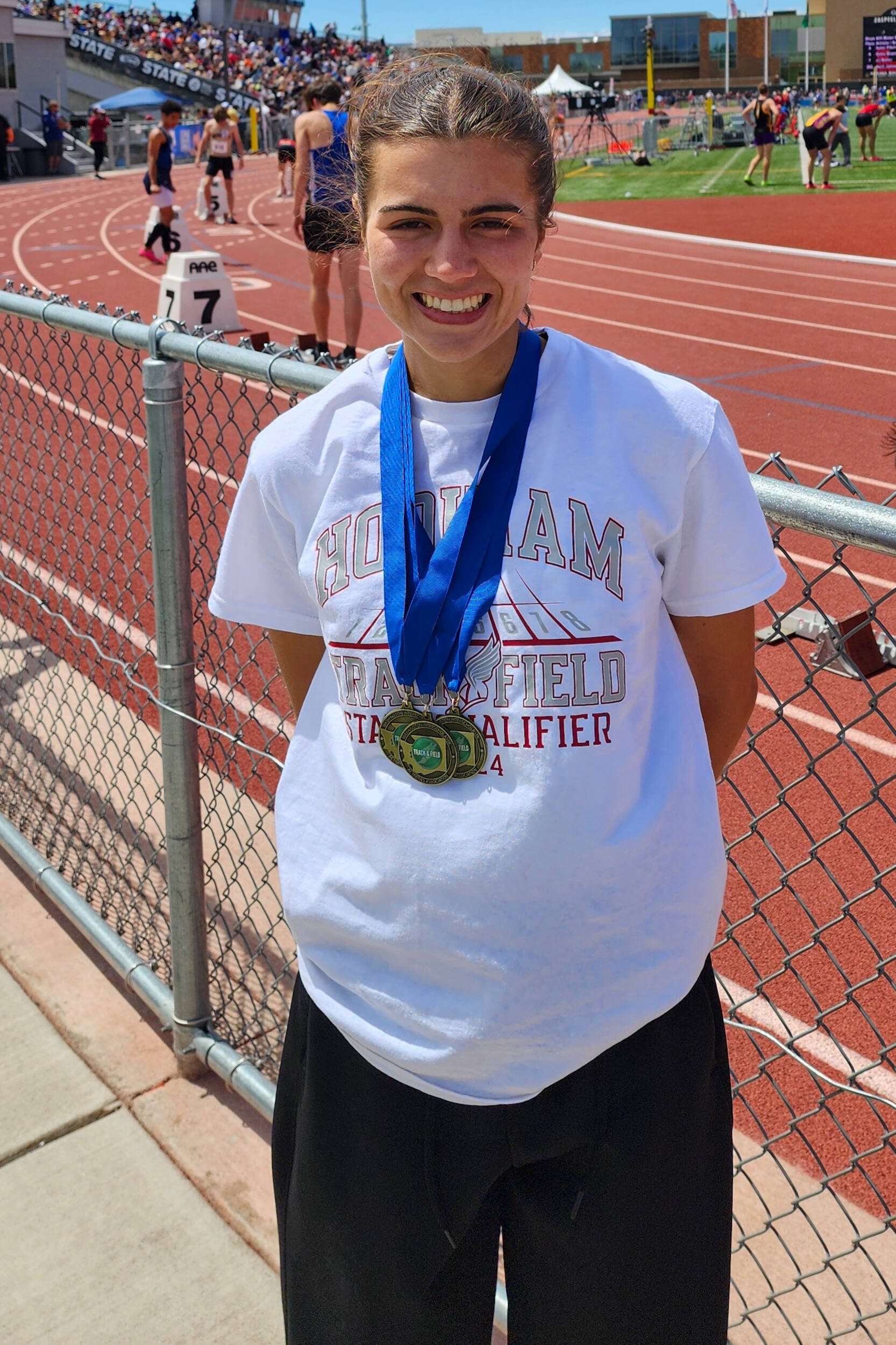 SUBMITTED PHOTO Hoquiam High School senior Jane Roloff poses for a photo after winning three state championships at the 1A State Championship Meet on May 25 at Eisenhower High School in Yakima.