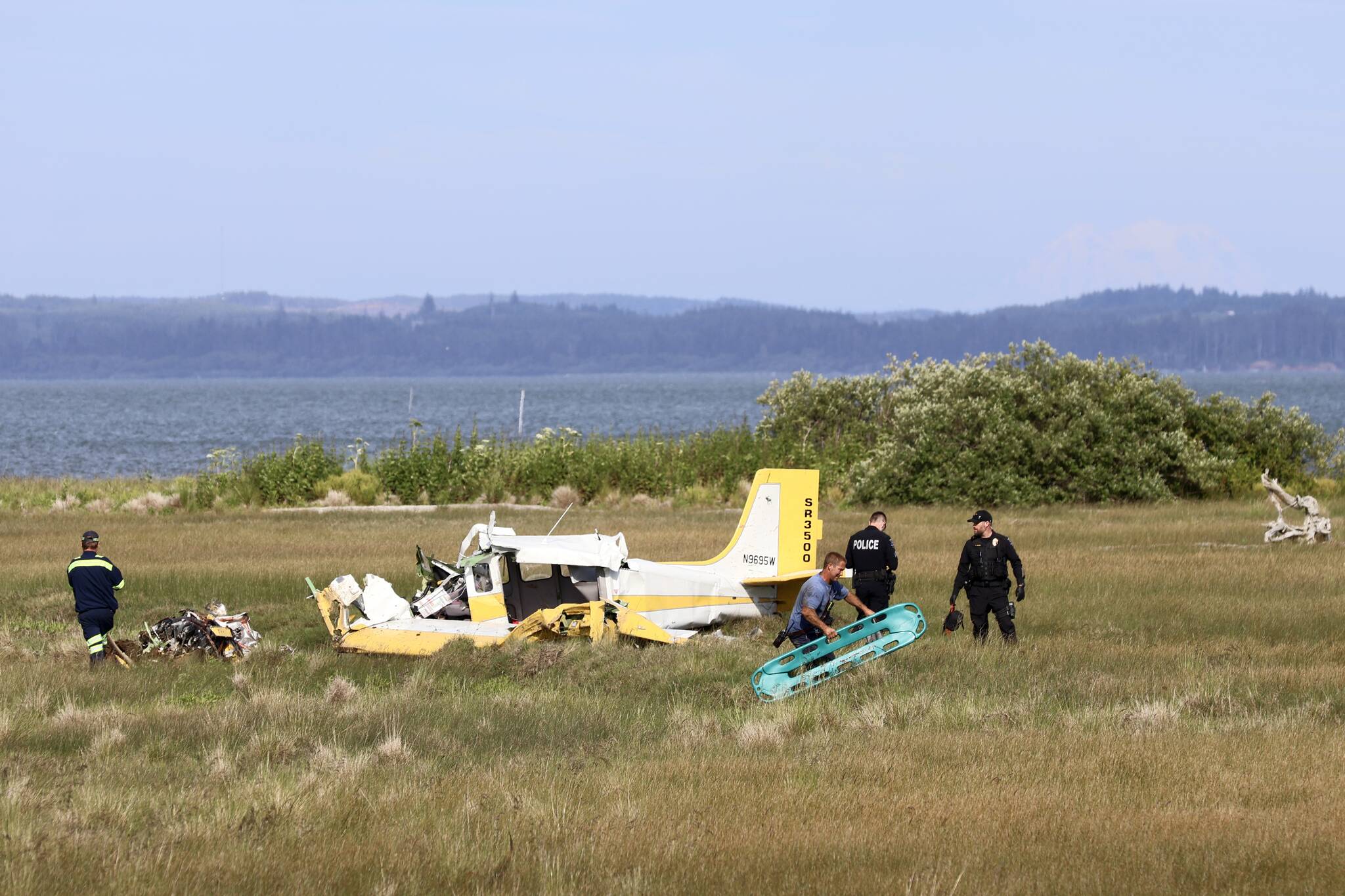 A plane crashed at Ocean Shores Municipal Airport on Saturday, June 8, from an unknown cause, injuring two. (Michael S. Lockett / The Daily World)
