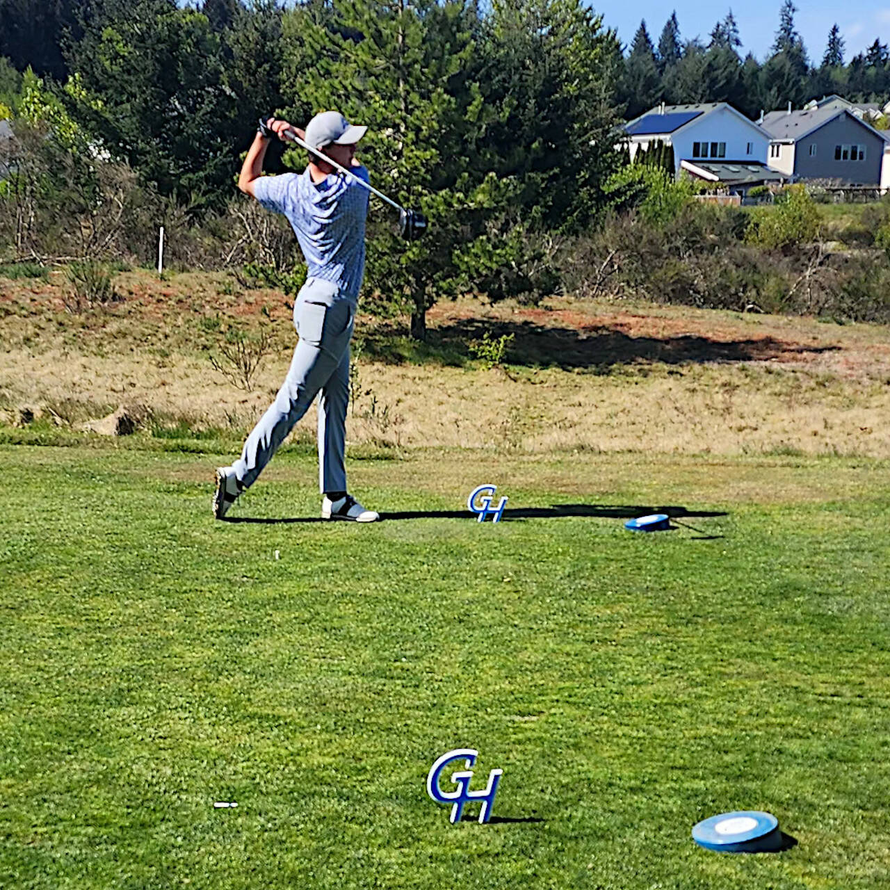 SUBMITTED PHOTO 
Grays Harbor College golfer Rasmus Tamker tees off during a GHC hosted meet in DuPont in late April. The college decided to suspend the men’s golf and men’s wrestling program on Monday.