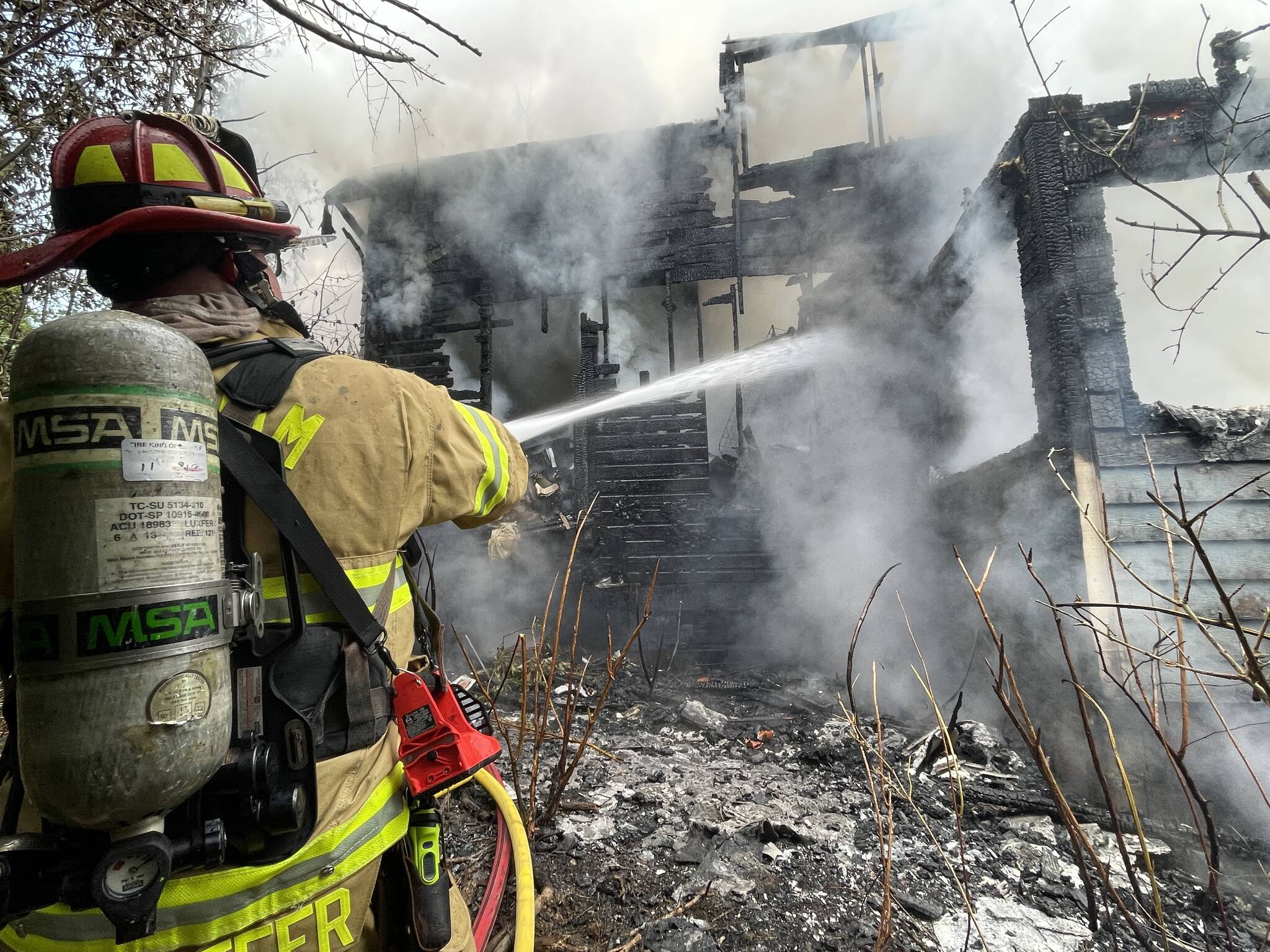 Fire tore through a Hoquiam residence on Tuesday evening. (Michael S. Lockett / The Daily World)