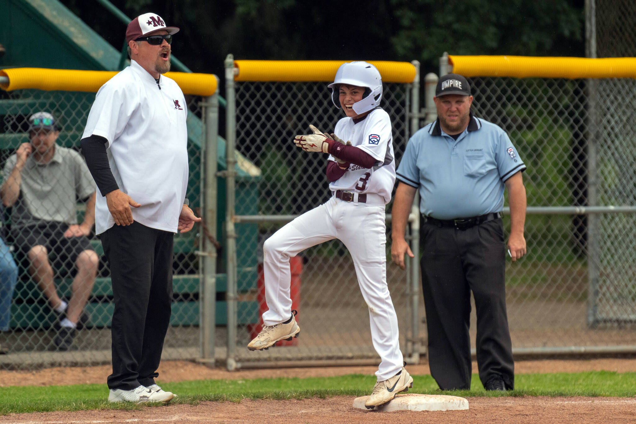 PHOTO BY FOREST WORGUM Montesano’s Brody Messick (3) celebrates after hitting a bases-clearing triple in a 12-4 win over Aberdeen in a Majors Division District 3 Tournament first-round game on Saturday in Centralia.