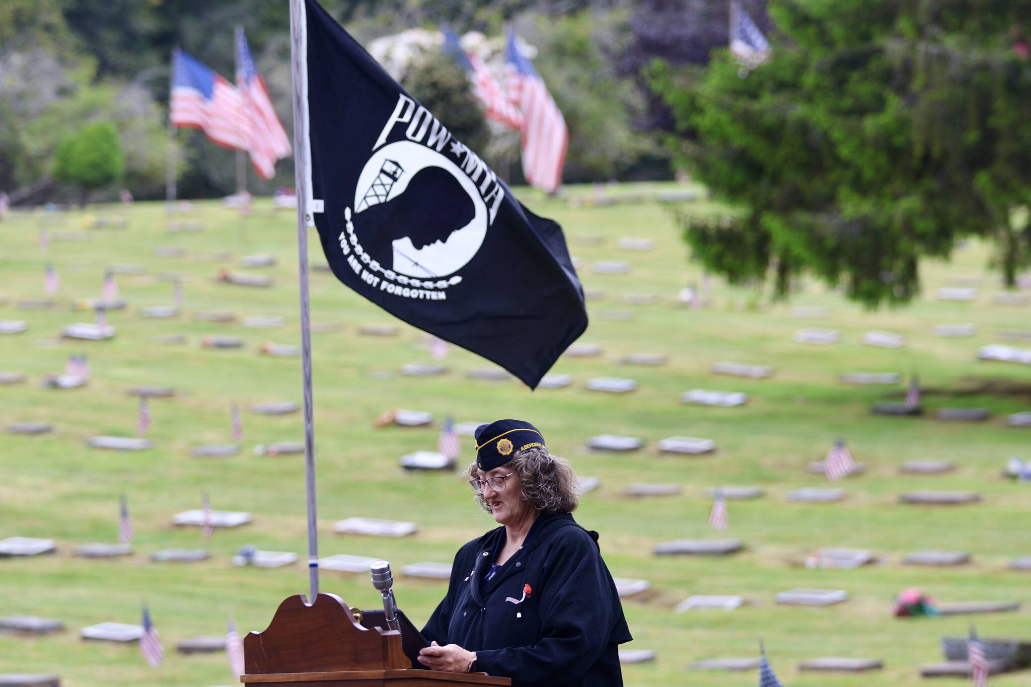 Grays Harbor County veteran relief fund ombudsman Gwyn Tarrence, seen here speaking at a Memorial Day event, had her contract extended by the county commission on Tuesday. (Michael S. Lockett / The Daily World File)