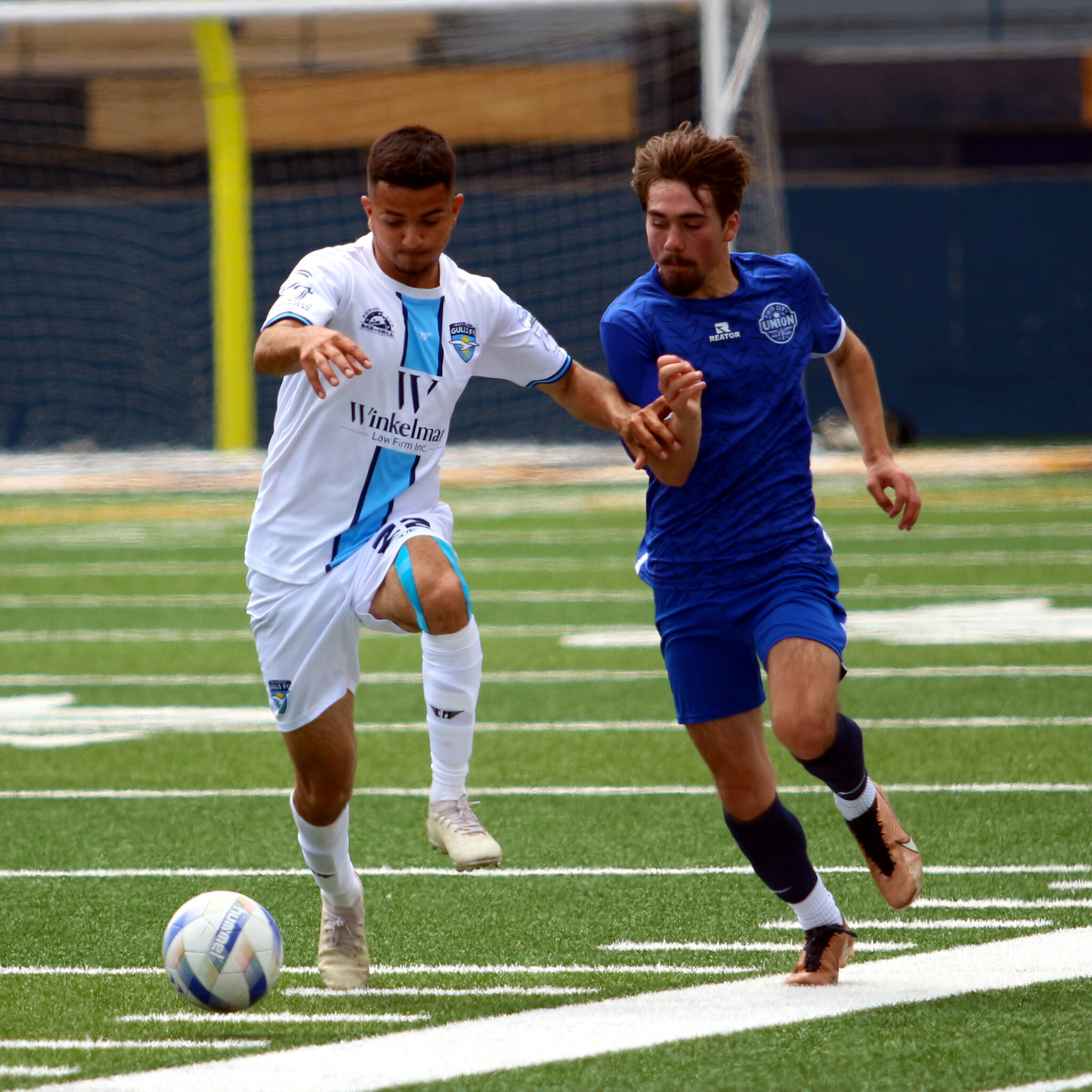 RYAN SPARKS | THE DAILY WORLD Grays Harbor Gulls defender Adonis Torres (left) dribbles forward during a 3-2 loss to Twin City Union on Sunday at Stewart Field in Aberdeen.
