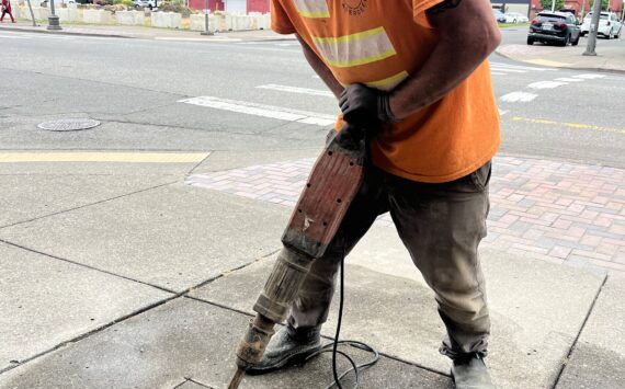 Matthew N. Wells / The Daily World
Jeff Stevens, lead carpenter for the city of Aberdeen, busts up pavement on a small patch of sidewalk that will host Darrell Westmoreland’s star. The music photographer is the 92nd Aberdeen Walk of Fame star recipient.