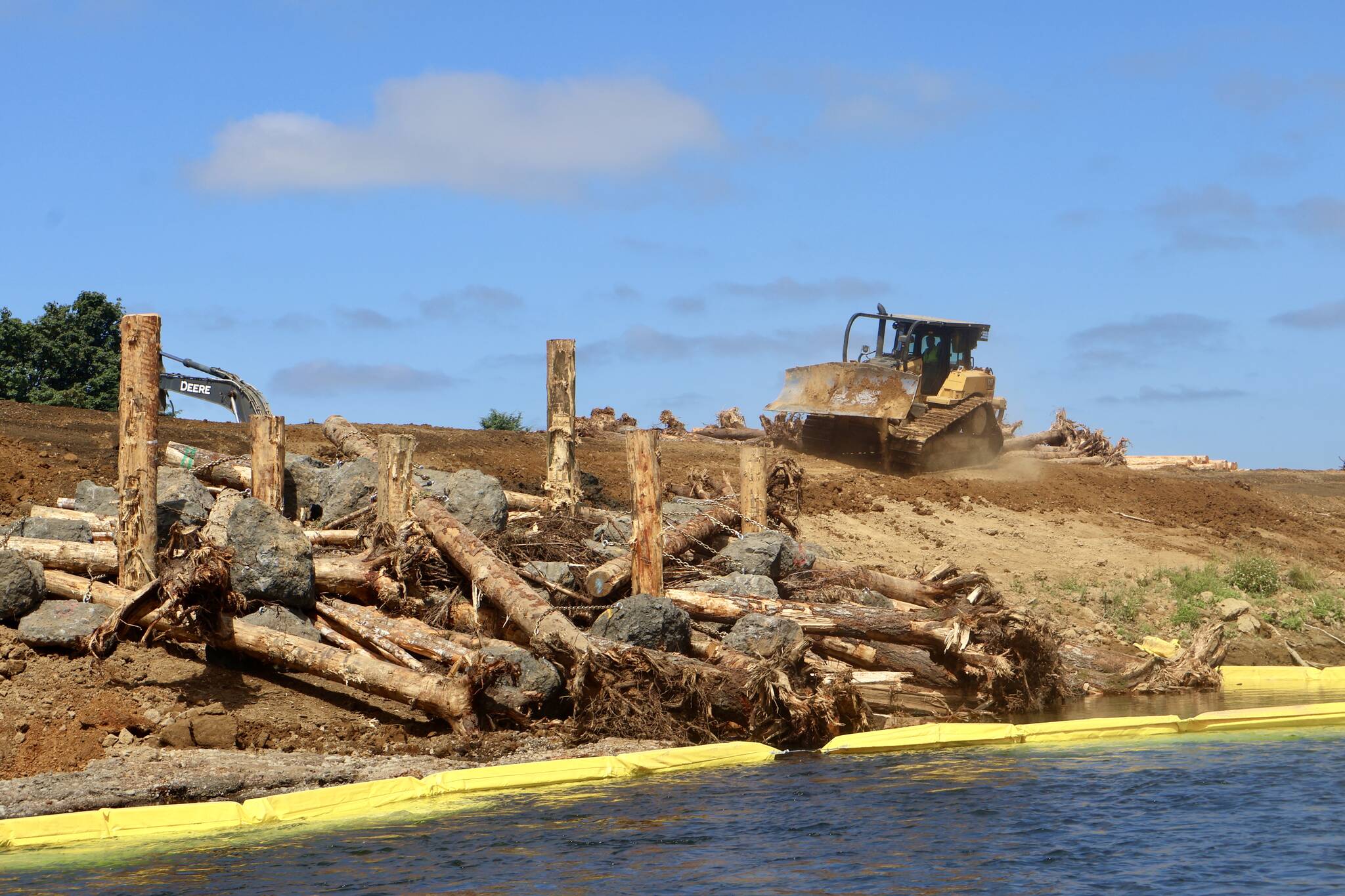 Machinery works around a new-built earthwork at a river conservation project on the Satsop River. (Michael S. Lockett / The Daily World)