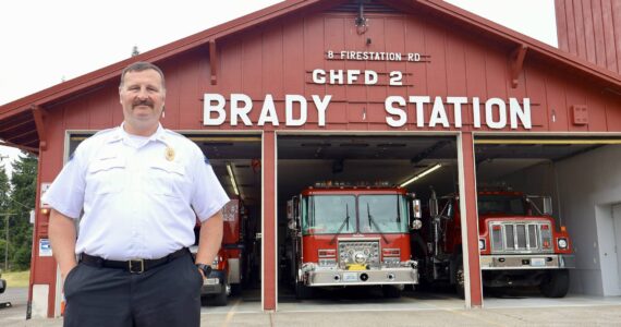 Michael S. Lockett / The Daily World
Chief John McNutt of Grays Harbor Fire District 2 stands in front of the Brady Station, currently having its siding replaced.