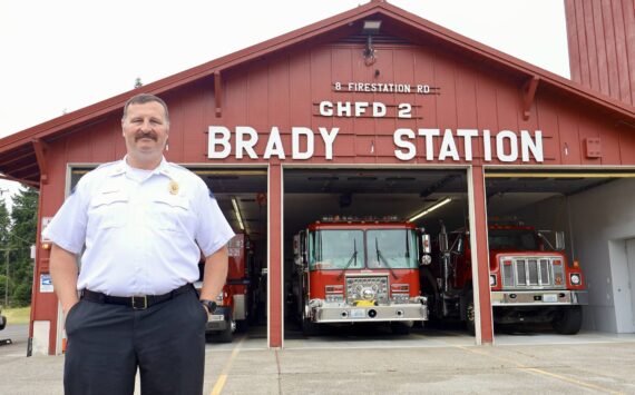Michael S. Lockett / The Daily World
Chief John McNutt of Grays Harbor Fire District 2 stands in front of the Brady Station, currently having its siding replaced.
