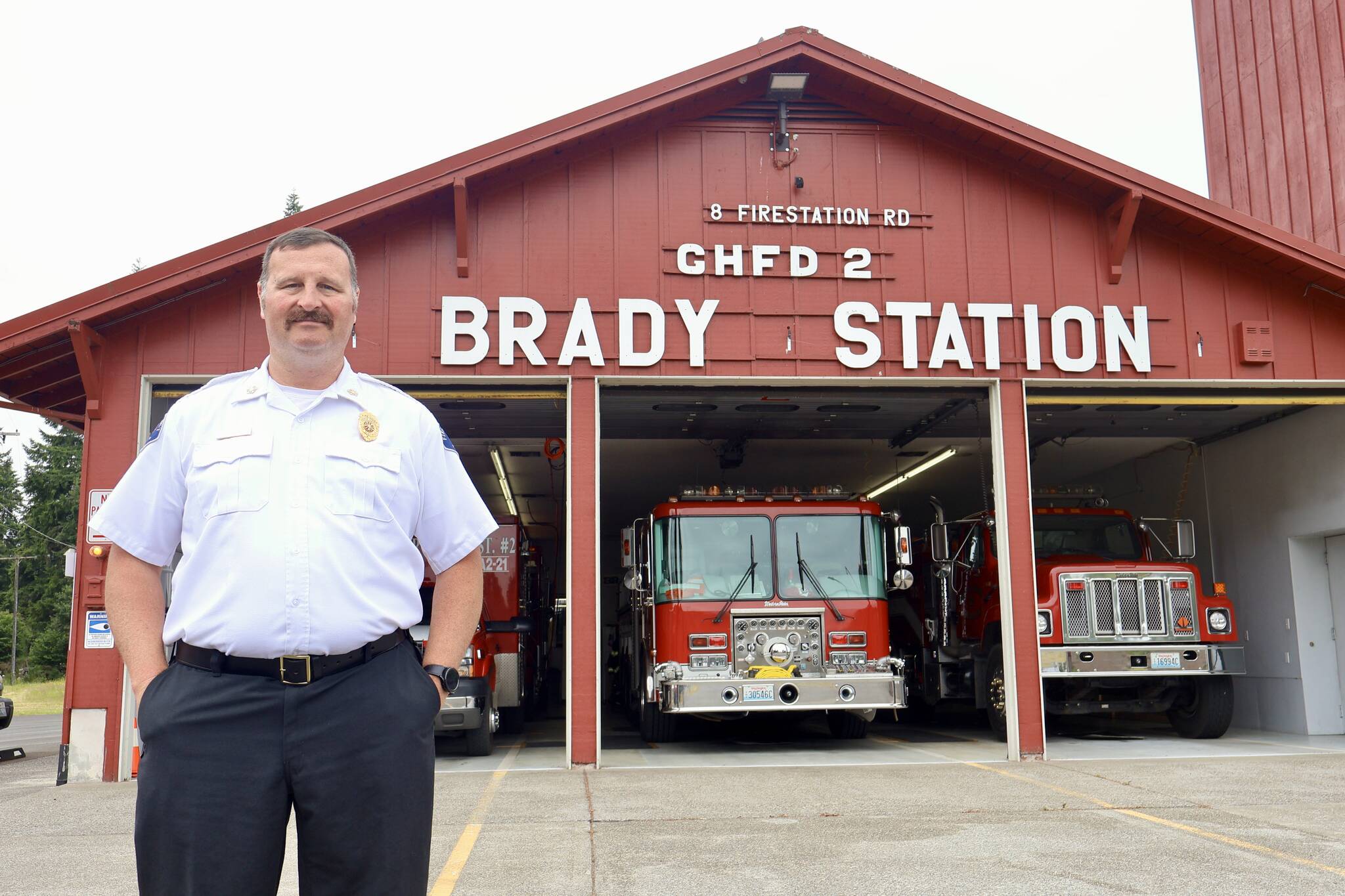 Chief John McNutt of Grays Harbor Fire District 2 stands in front of the Brady Station, currently having its siding replaced. (Michael S. Lockett / The Daily World)