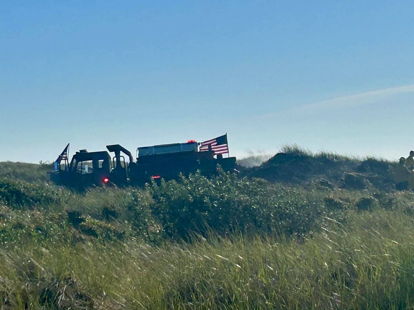 Ocean Shores firefighters mop up after a dune grass fire on Tuesday. (Courtesy photo / OSFD)