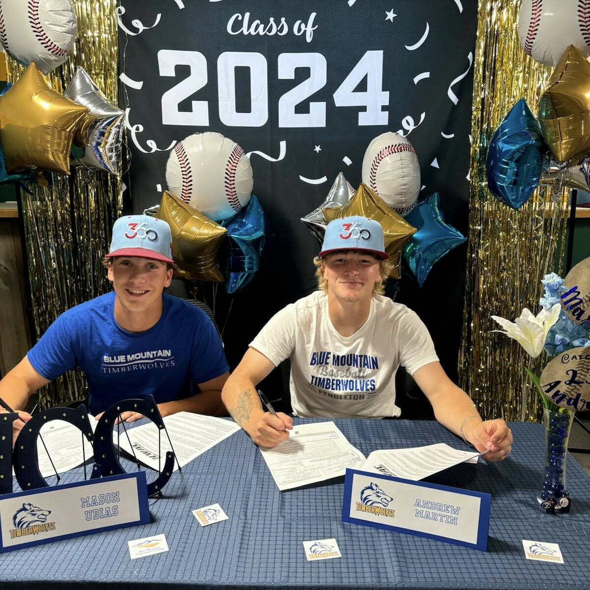 Ocosta’s Andrew Martin (right) and Rochester’s Mason Ubias signed Letters of Intent to play baseball for Blue Mountain Community College during a ceremony at Multi-Sport 360 in Montesano.