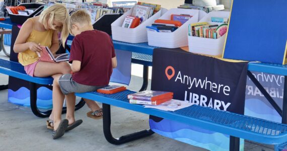 Michael S. Lockett / The Daily World
Kids read books during an Anywhere Library visit to Cosmopolis, the first stop as the program stands up in the county.