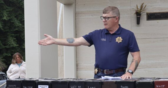 Michael S.Lockett / The Daily World
County Coroner George Kelley speaks during a brief ceremony, interring the unclaimed dead.