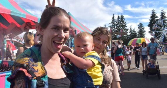 Matthew N. Wells / The Daily World
Melody Wilson, left, her two-year-old Raylan and her 12-year-old Peyton, enjoy their time Saturday at the Grays Harbor County Fair in Elma. The fair saw so many smiles and there was so much laughter as people, like the Wilsons, rode spinning rides, such as the “Zipper,” played carnival games, ate huge portions of curly fries and quenched their thirst on cold lemonade.