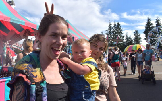 Matthew N. Wells / The Daily World
Melody Wilson, left, her two-year-old Raylan and her 12-year-old Peyton, enjoy their time Saturday at the Grays Harbor County Fair in Elma. The fair saw so many smiles and there was so much laughter as people, like the Wilsons, rode spinning rides, such as the “Zipper,” played carnival games, ate huge portions of curly fries and quenched their thirst on cold lemonade.