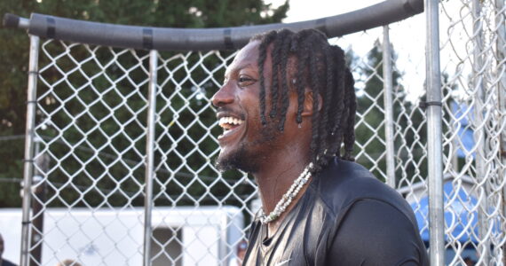 Matthew N. Wells / The Daily World
Tariq Woolen, Seattle Seahawks’ cornerback, teamed up with Five Star Dealerships to raise money for Summit Pacific Medical Center, in Elma. Woolen sat in a dunk tank as many children, teens and adults alike threw softballs at a target. It cost $5 for three throws. At least one participant paid $20 in order to be allowed to automatically dunk Woolen.