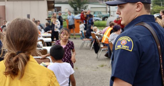 Michael S. Lockett / The Daily World
Firefighters and police take a moment to mingle with residents during a National Night Out event in Hoquiam.