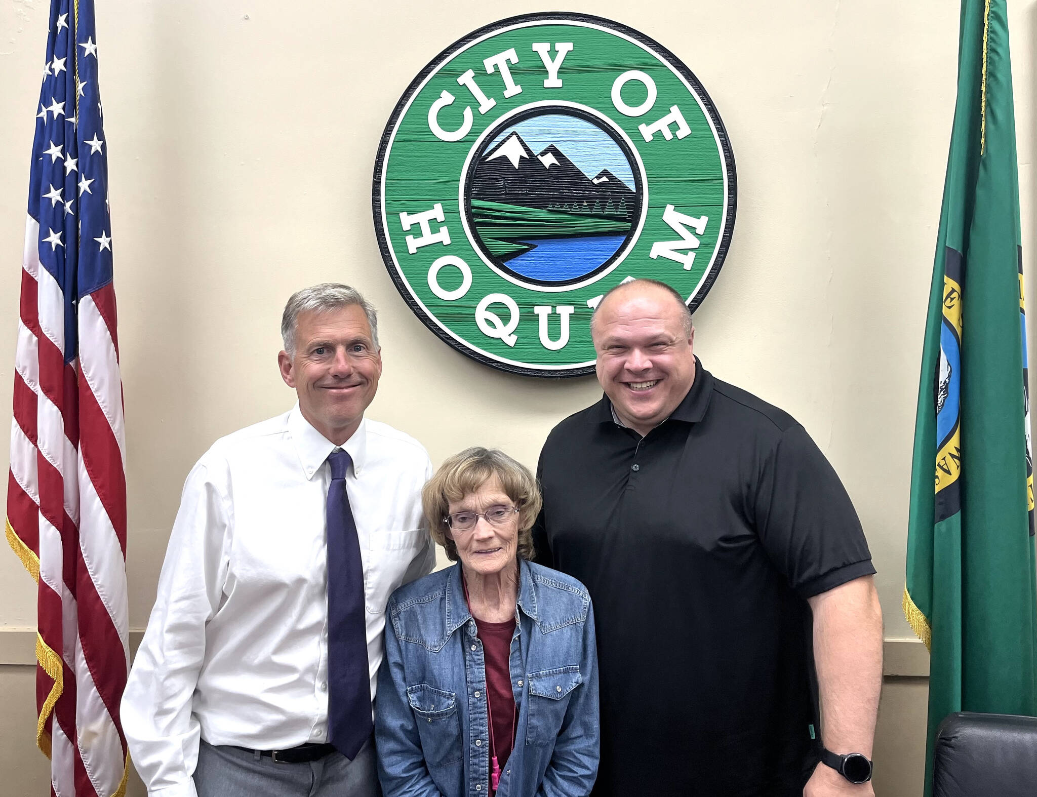 Hoquiam City Administrator Brian Shay, left, and Hoquiam Mayor Ben Winkelman, right, stand with Tracy Wood, who has served many roles with the city for 30 years. Wood is retiring from the city this week. In addition to so many projects, grants written, and other key ways she’s helped the city, Wood has served as the Hoquiam City Council secretary and the city’s community services coordinator. Anyone who would like to celebrate Wood’s retirement can do so Friday at 5:30 p.m., at 8th Street Ale House — 207 8th St., in Hoquiam. (Matthew N. Wells / The Daily World)