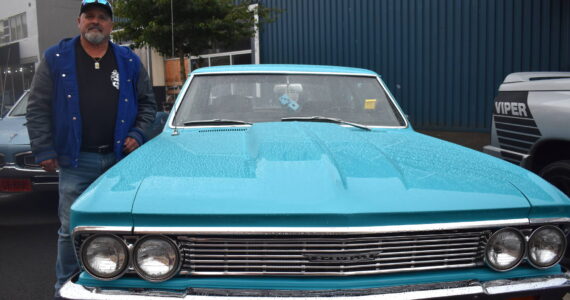 Matthew N. Wells / The Daily World
The rain on Saturday didn’t stop Doug Smith’s metal baby, a 1966 Chevrolet Chevelle 300, from shining on South Broadway Street in Aberdeen. Smith spoke about much of what he’s had to do in the last 13 years in order to bring the classic muscle car back from what seemed like its end.