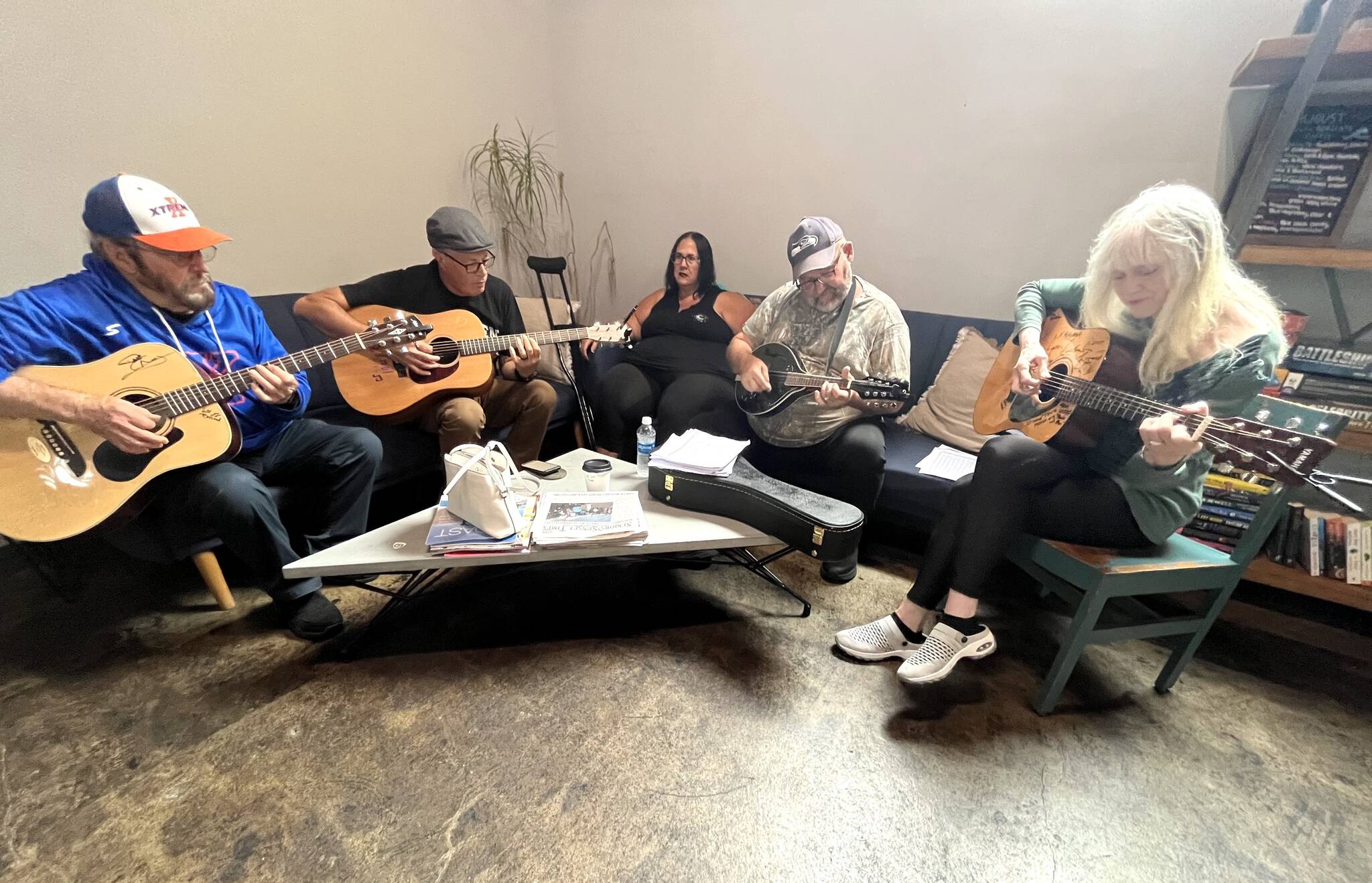 Matthew N. Wells / The Daily World
From left: Doug Paling, Wil Russoul, Norma Carter, Adam Carter and Jane Sharp all enjoy the impromptu jam session that Noon Tunes offers musicians and music lovers at Tinderbox Coffee Roasters — 113 E. Wishkah St., in Aberdeen.