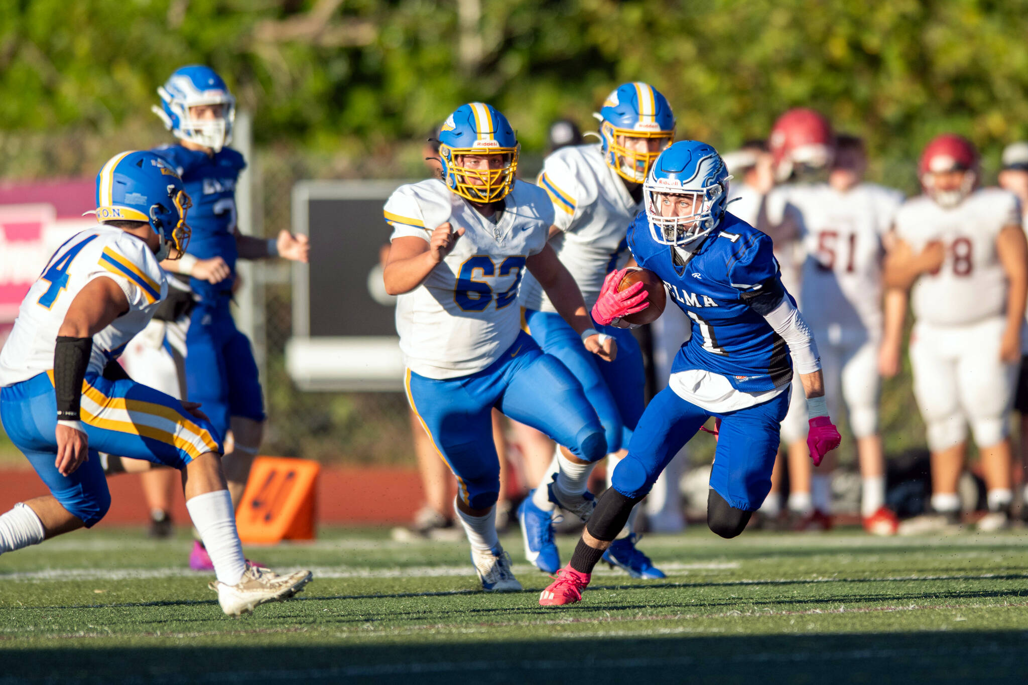 PHOTO BY FOREST WORGUM Elma receiver Ethan Camus (right) looks for running room after making a catch during the Montesano Football Jamboree on Friday in Montesano.