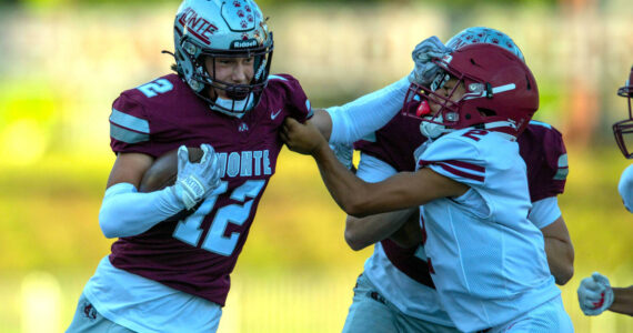 PHOTO BY FOREST WORGUM 
Montesano’s Toren Crites (12) attempts to avoid the tackle by Hoquiam’s Junior Soto during the Montesano Jamboree on Aug. 30. The two teams open the season with home games on Friday.