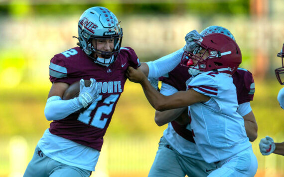 PHOTO BY FOREST WORGUM 
Montesano’s Toren Crites (12) attempts to avoid the tackle by Hoquiam’s Junior Soto during the Montesano Jamboree on Aug. 30. The two teams open the season with home games on Friday.