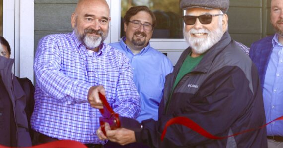 Michael S. Lockett / The Daily World
Westport City Administrator Kevin Goodrich and Harbor Regional Health Commissioner Michael Bruce cut the ceremonial ribbon opening a new clinic in Westport.