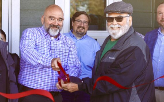 Michael S. Lockett / The Daily World
Westport City Administrator Kevin Goodrich and Harbor Regional Health Commissioner Michael Bruce cut the ceremonial ribbon opening a new clinic in Westport.