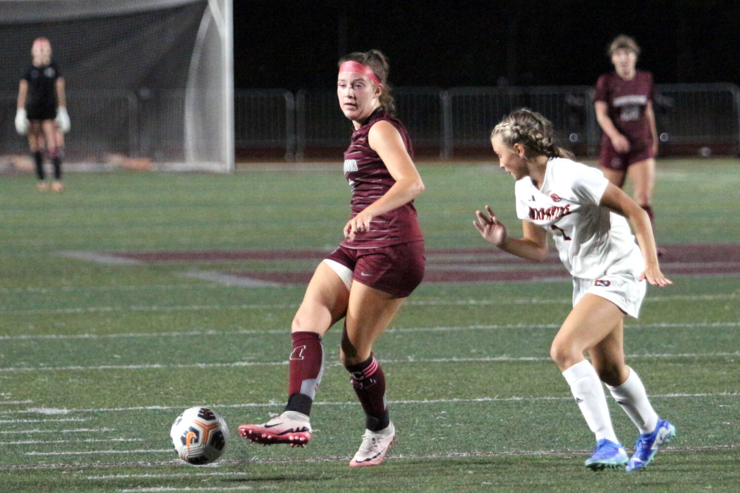 RYAN SPARKS | THE DAILY WORLD Montesano midfielder Sam Roundtree (left) passes the ball during a 5-0 season-opening win over Napavine on Thursday at Jack Rottle Field in Montesano.