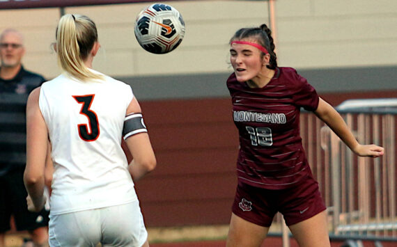 RYAN SPARKS | THE DAILY WORLD Montesano defender Emily Kuntz (18) heads the ball against Napavine’s Hayden Kaut during the Bulldogs’ 5-0 win on Thursday at Montesano High School.