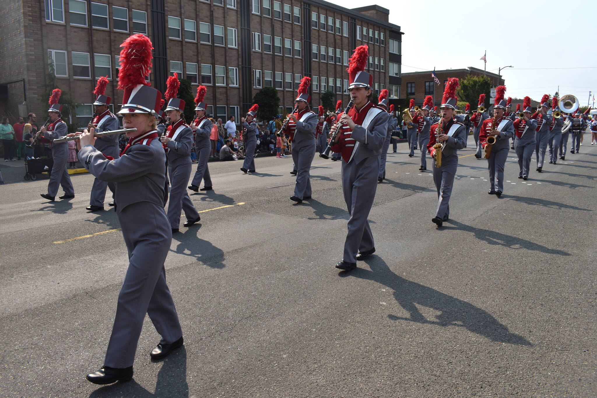 Matthew N. Wells / The Daily World
Hoquiam High School Marching Band plays to a massive crowd as they march down 8th Street in downtown Hoquiam on Saturday. The clarinet player in the center of the photo, Cody Baller, brought a twinkle to the eye of his mom, Leah Baller.