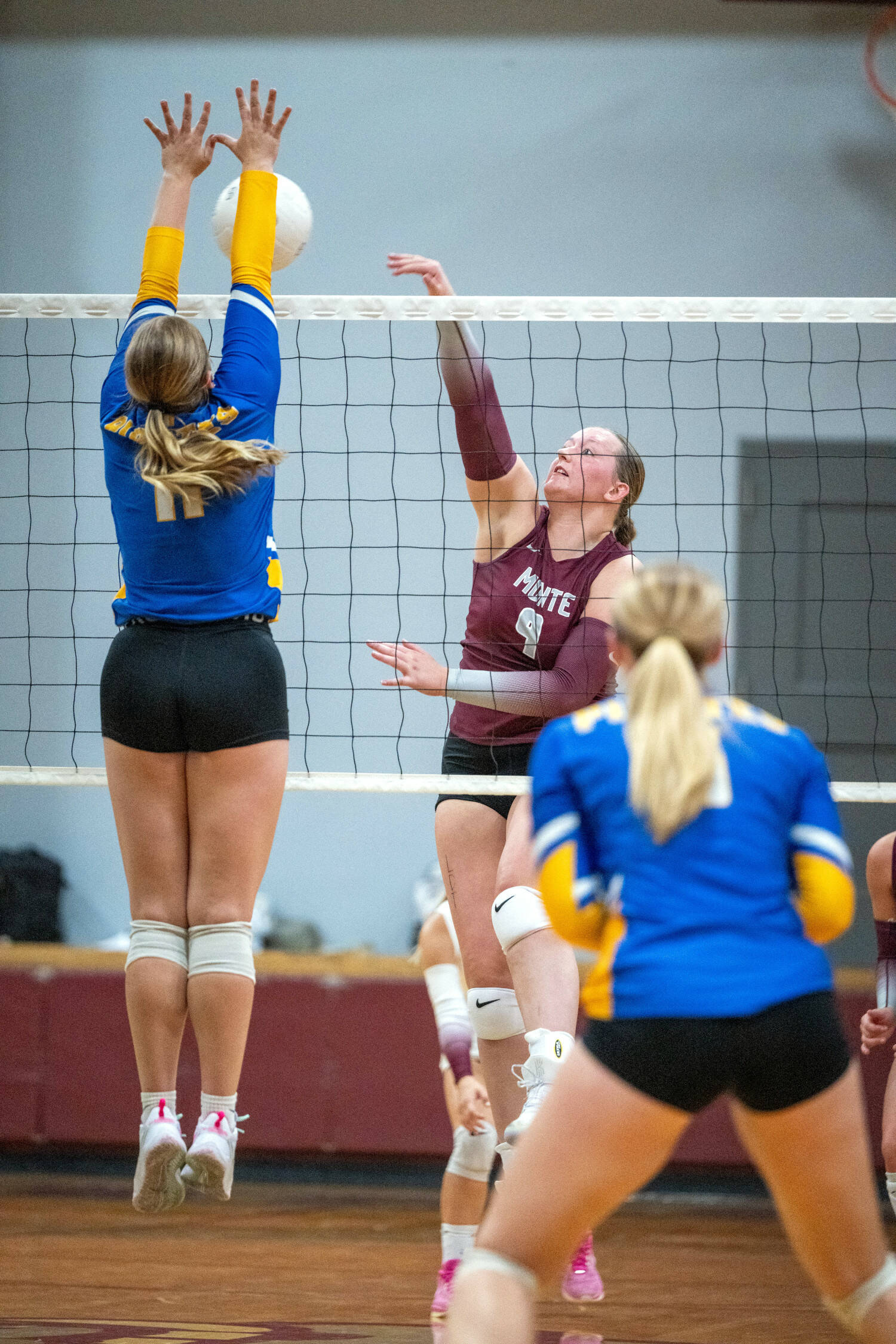 PHOTO BY FOREST WORGUM Montesano middle blocker Kylee Wisdom (9) attempts a shot against Adna’s Kendall Humphrey (11) during the Bulldogs’ 3-0 loss on Monday at Montesano High School.