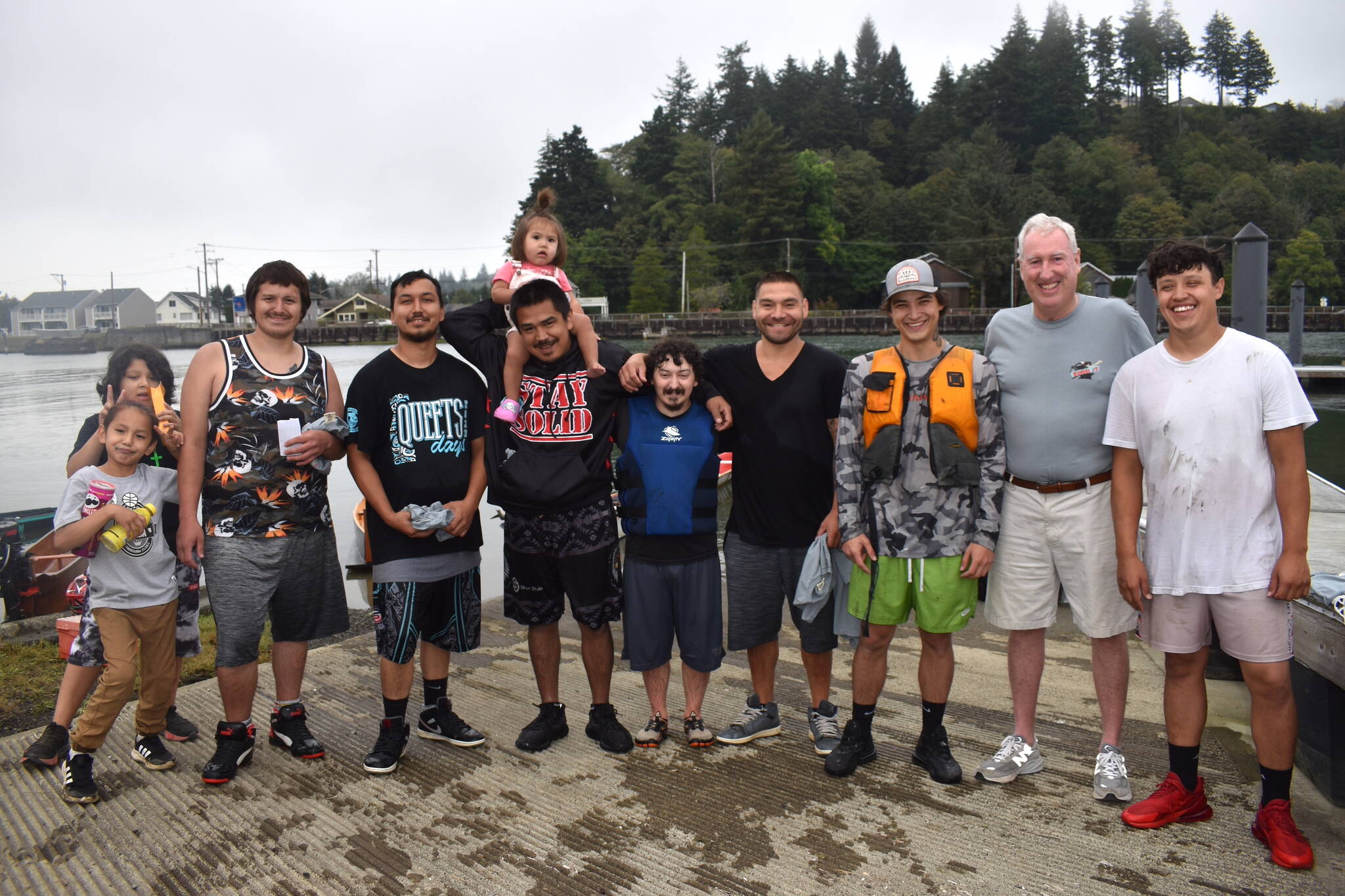 Matthew N. Wells / The Daily World
Tim Quigg, the tallest man in the photo, stands with every single racer on Saturday, plus a few, possibly future racers. Several people vocalized their gratitude for Quigg’s hard work to bring the canoe races back to Hoquiam River after about 40 years of absence.