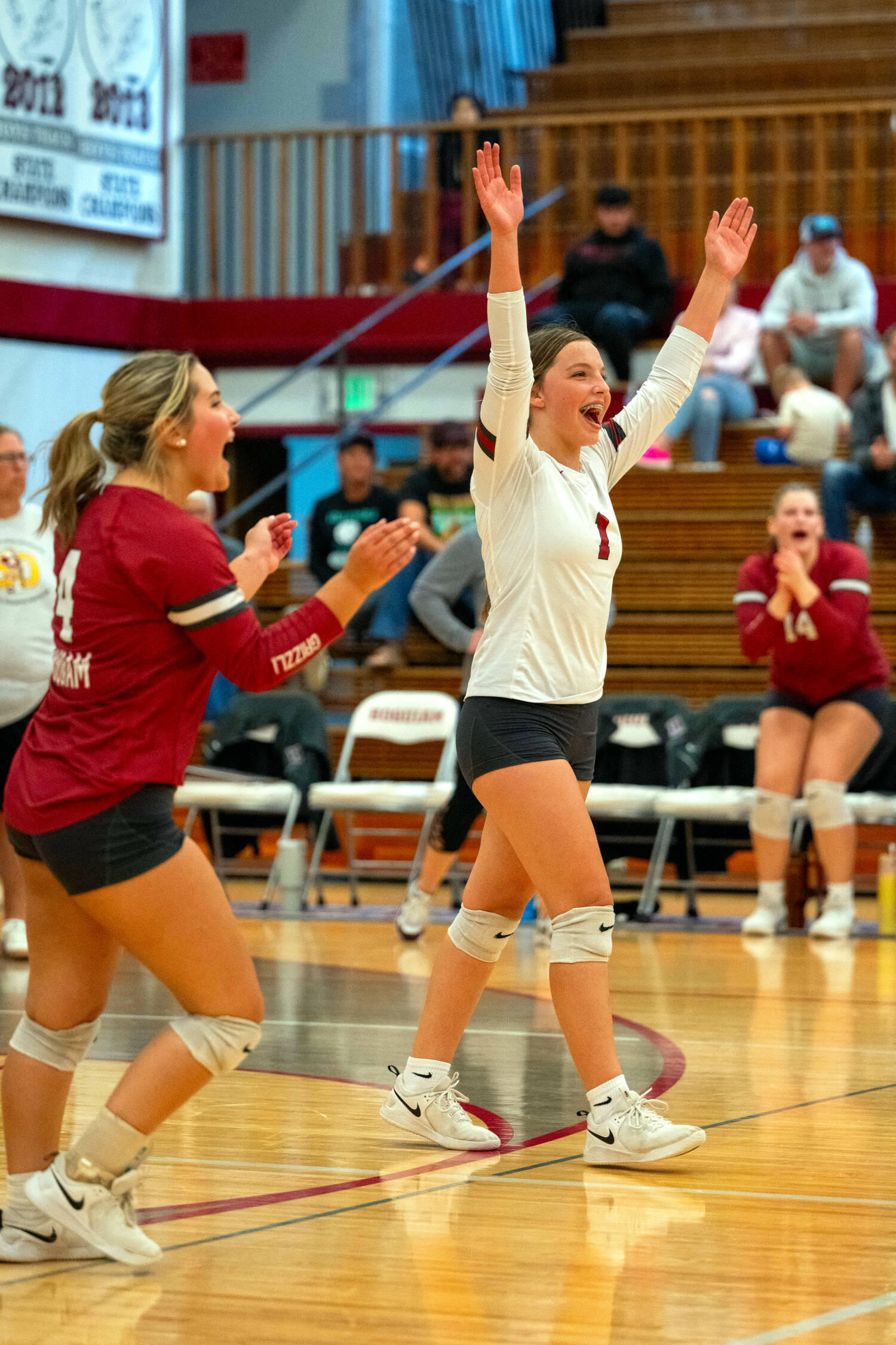 PHOTO BY FOREST WORGUM Hoquiam’s Lexi LaBounty (right) and Avery Templar celebrate a point during the Grizzlies’ straight-set victory over Forks on Tuesday at Hoquiam Square Garden.